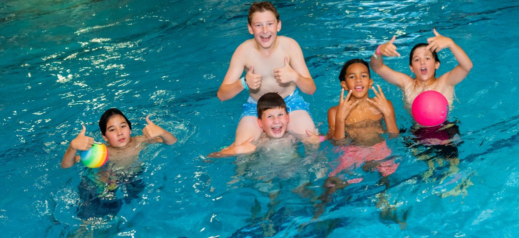 Teens have fun in the PRC pool at a Teen Night.