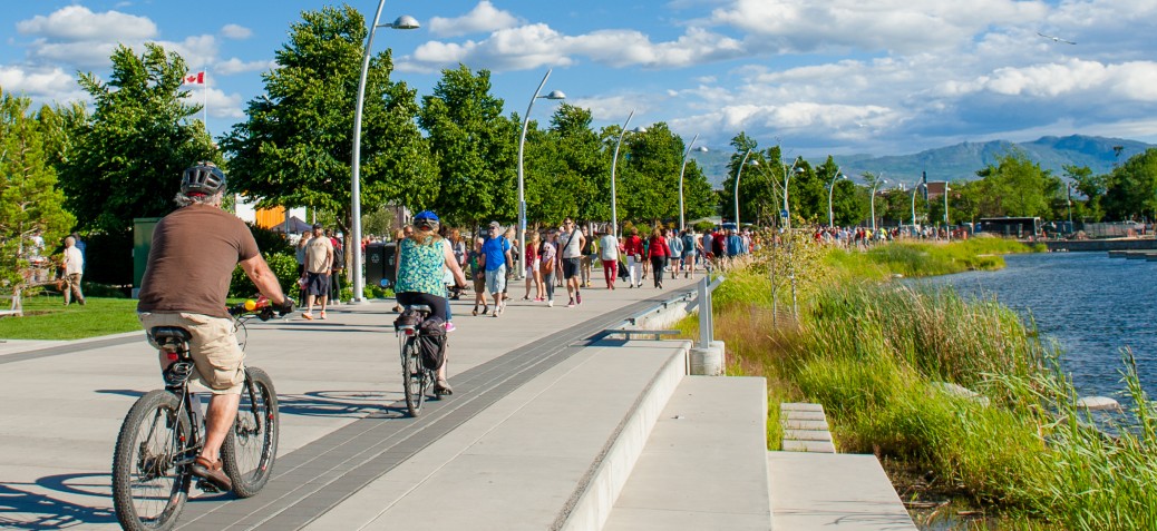 Residents walking through Stuart Park on a sunny day