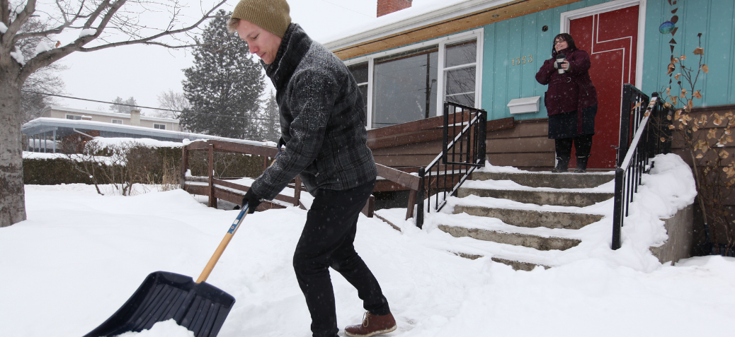 Resident clearing snow