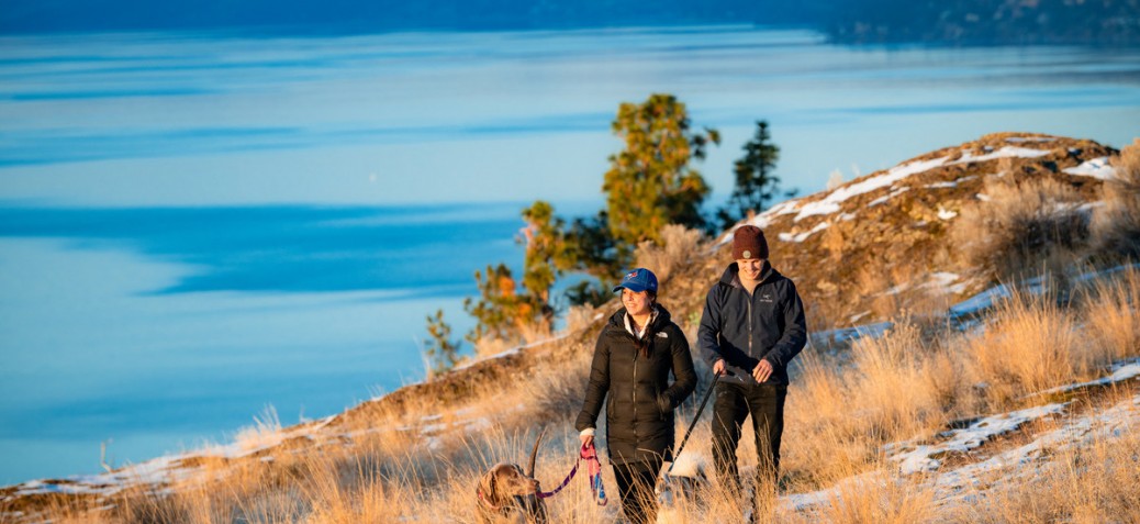 Active by Nature - winter Two people walking dog.
