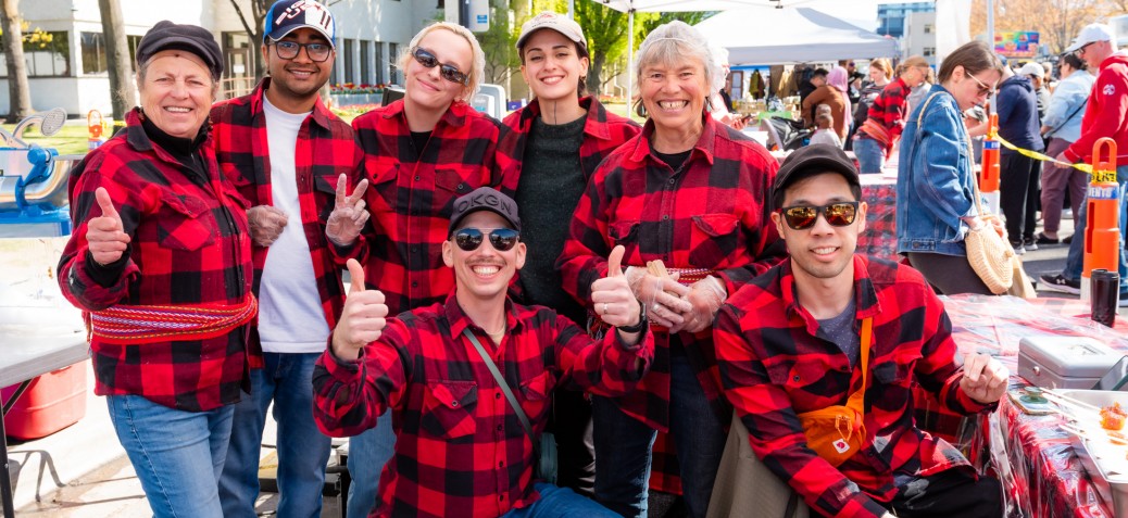 MapleFest group MapleFest group of people in red and black Canadian plaid