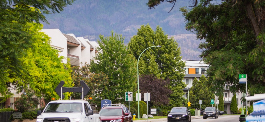 Kelowna Apartments Image of street in Kelowna showing apartment buildings