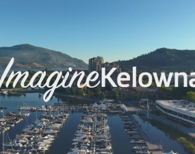 Imagine Kelowna cover photo overlooking downtown marina